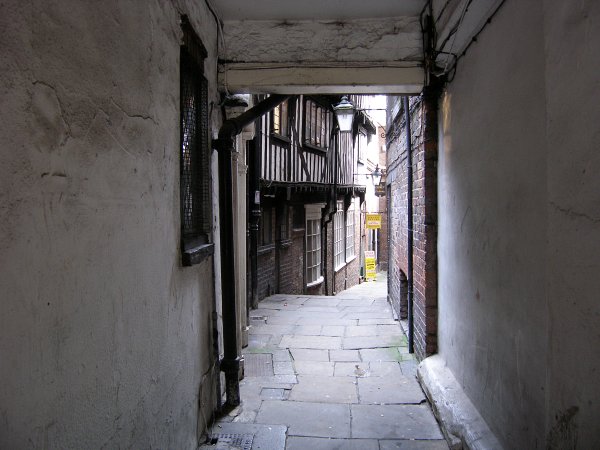 passage (or snickelway) leading through to the yard.